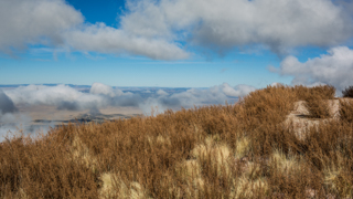 Image of Socorro Valley, looking down from M Mountain, with clouds in the sky