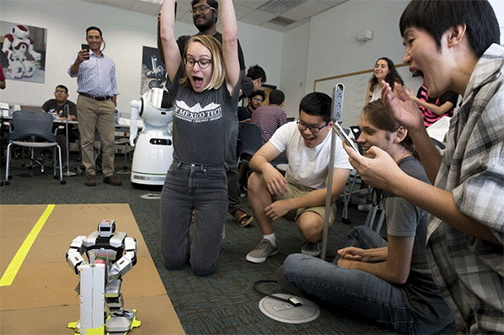 Tessa Guengerich reacts to her robot's successful demonstration