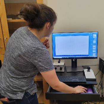 Dr. Nicole Hurtig examining data from the Raman instrument