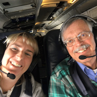 Dr. Zeljka Fuchs-Stone and Dr. Dave Raymond in the cockpit of a plane.