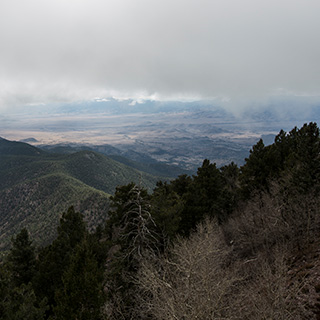 Image of a mountain canyon with a cloudy sky.