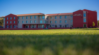 An image of the Torres Hall student apartments from the NMT Athletic Field.