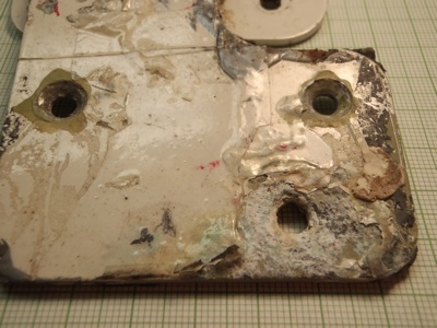 Image of aluminum alloy plate in various states of corrosion.