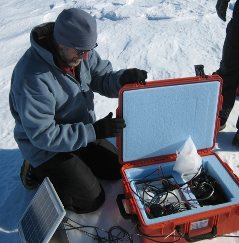 Dr. Phillip Kyle installs a sensing device on Mt. Erebus