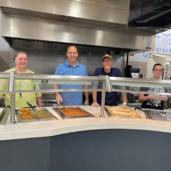 Faculty volunteers at midnight breakfast