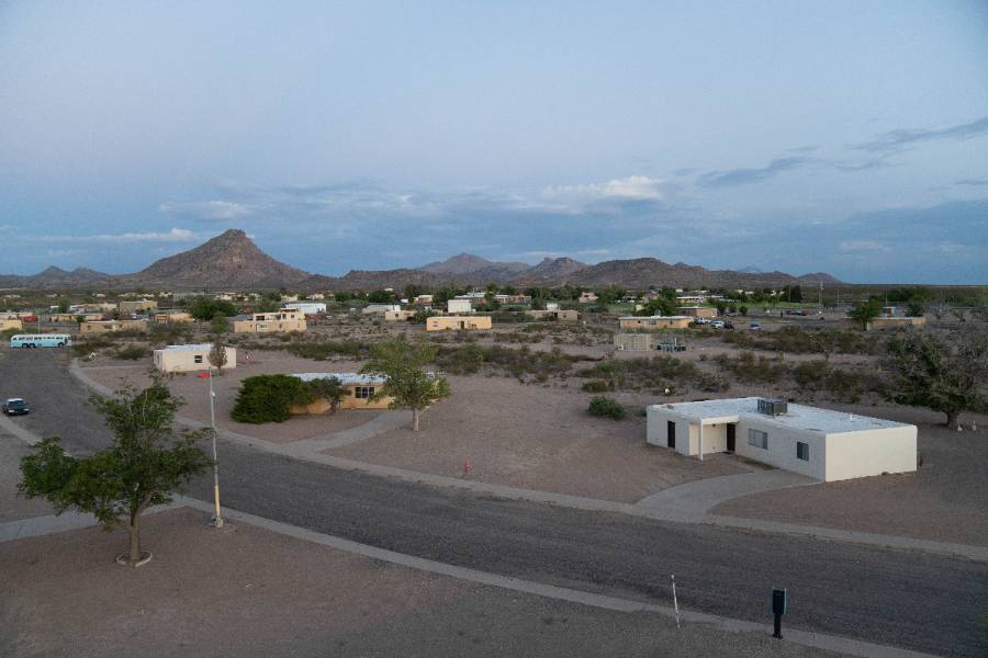 Wide shot of the Playas center with mountains in the background.