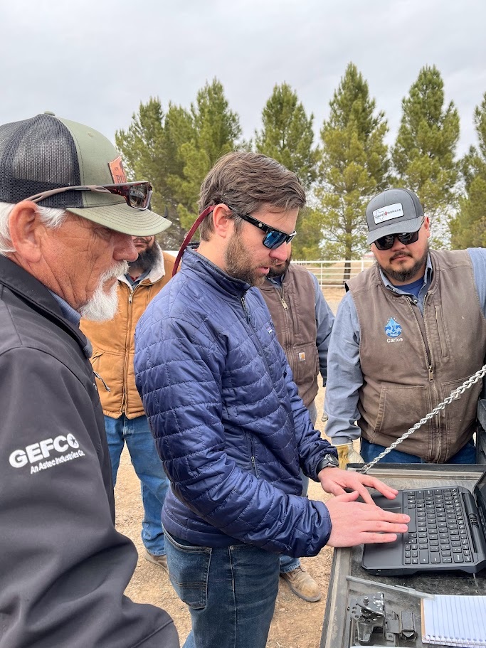 NMBGMR’s Chris Cox demonstrates the meter manager application to PVACD’s team. Photo by Rachel Hobbs