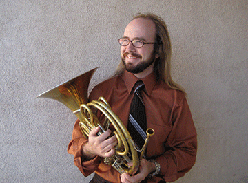 Peter Erb posed with french horn