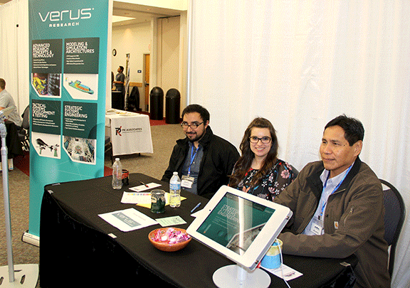 Verus Research staff members at their booth