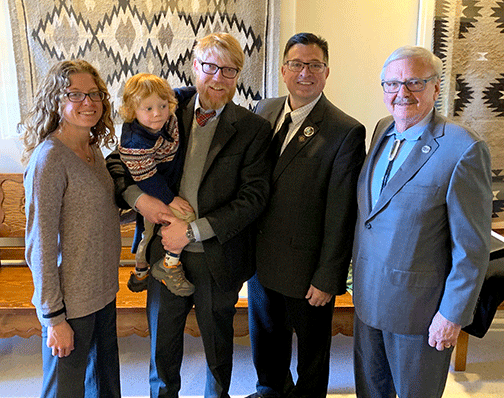 Ben Duval, with his wife and child, NMED secretary, and NMT president