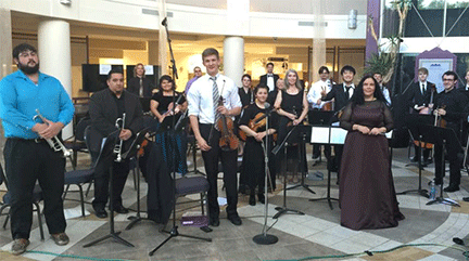 The NMT orchestra posting at a Fidel center performance