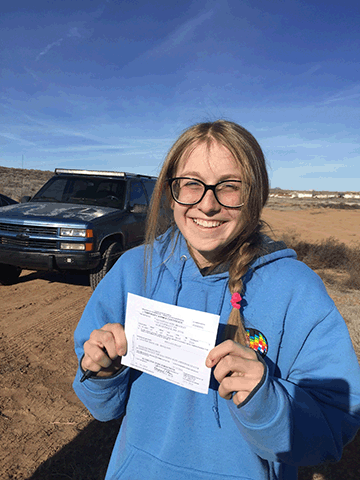 Savannah Bradley with her pilot's certificate